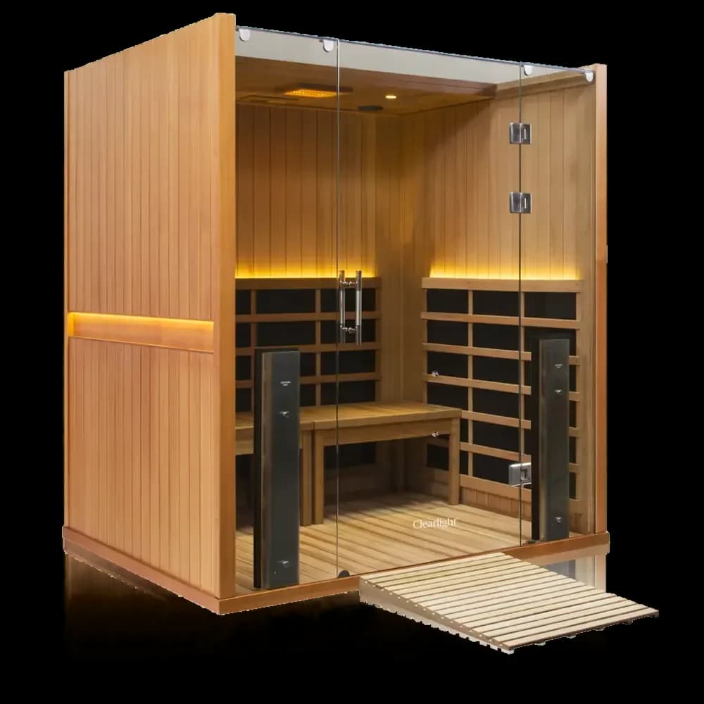 Clearlight Sanctuary Retreat sauna in reddish wood, glass front and a slatted wood access ramp at the door